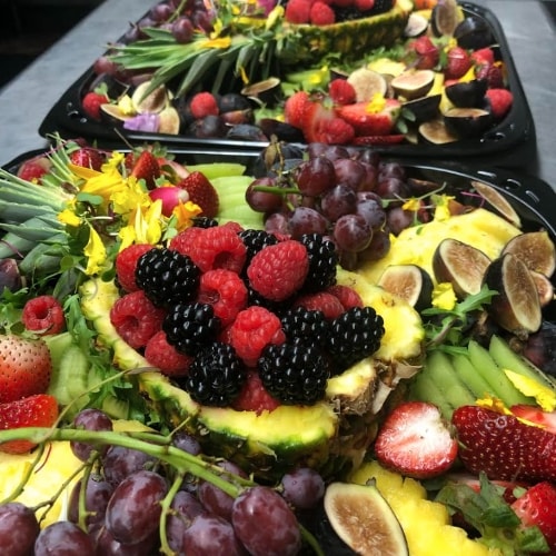 Multiple platters of fruit